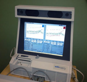 Demonstrating real-ear measurement with console.